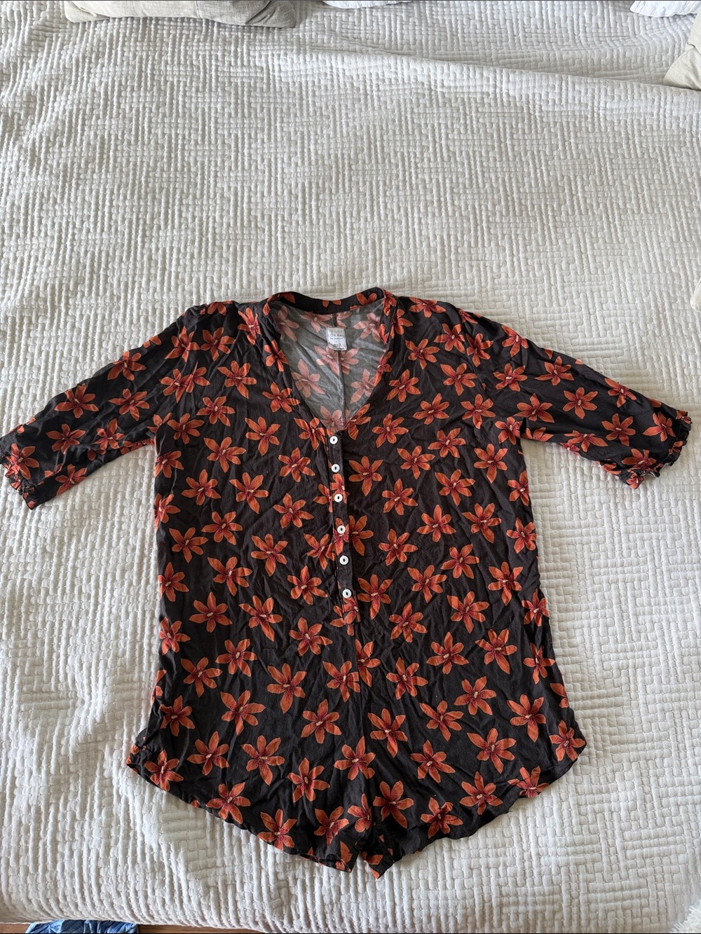 Lokahi romper 3/4 sleeve.  Black Button-Front Top with Orange Floral Print